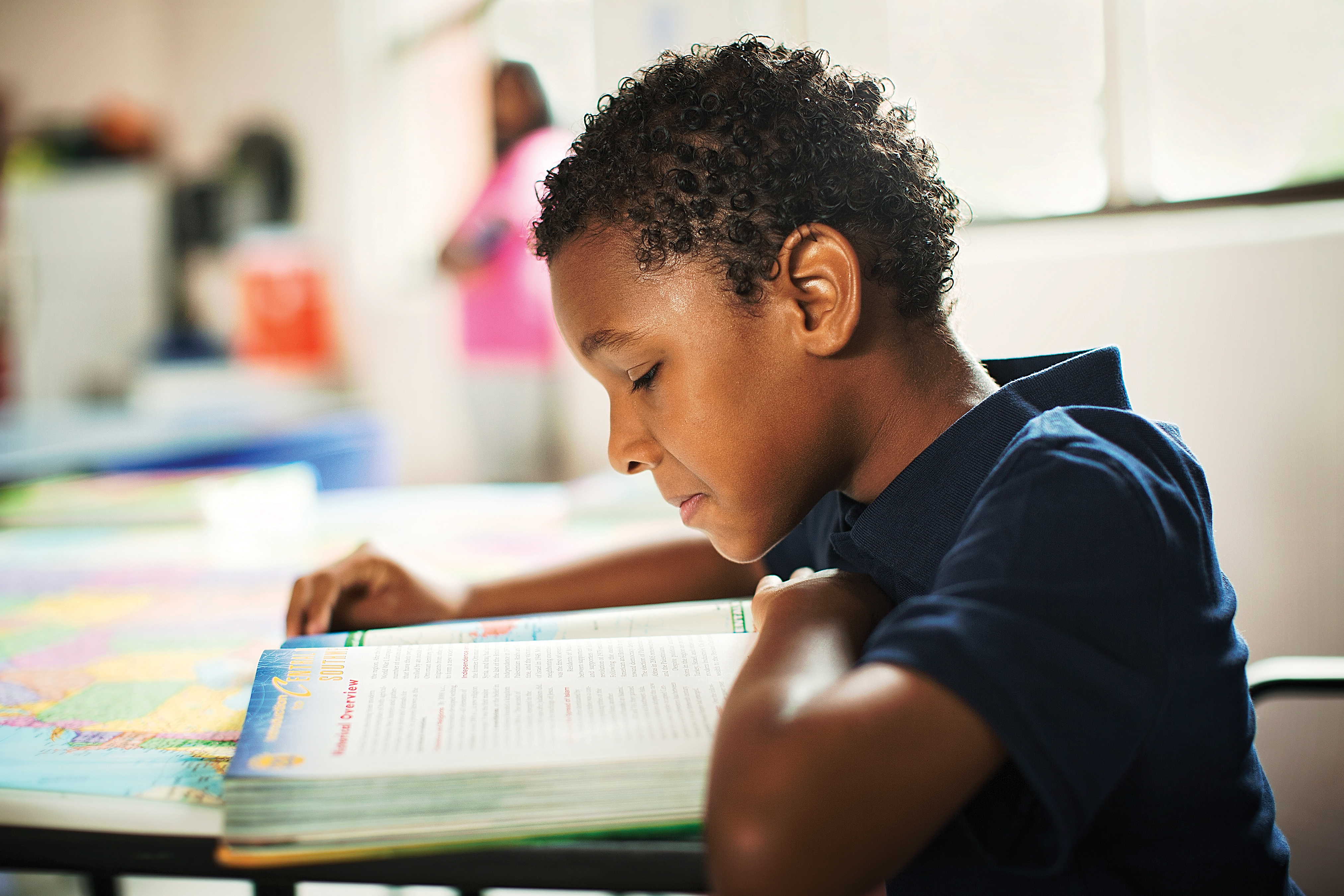 Child reading book - YMCA