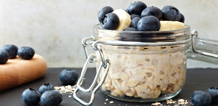 Overnight oats in a clamp lid jar topped with blueberries and banana slices