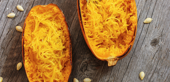 Baked spaghetti squash on a wooden tabletop