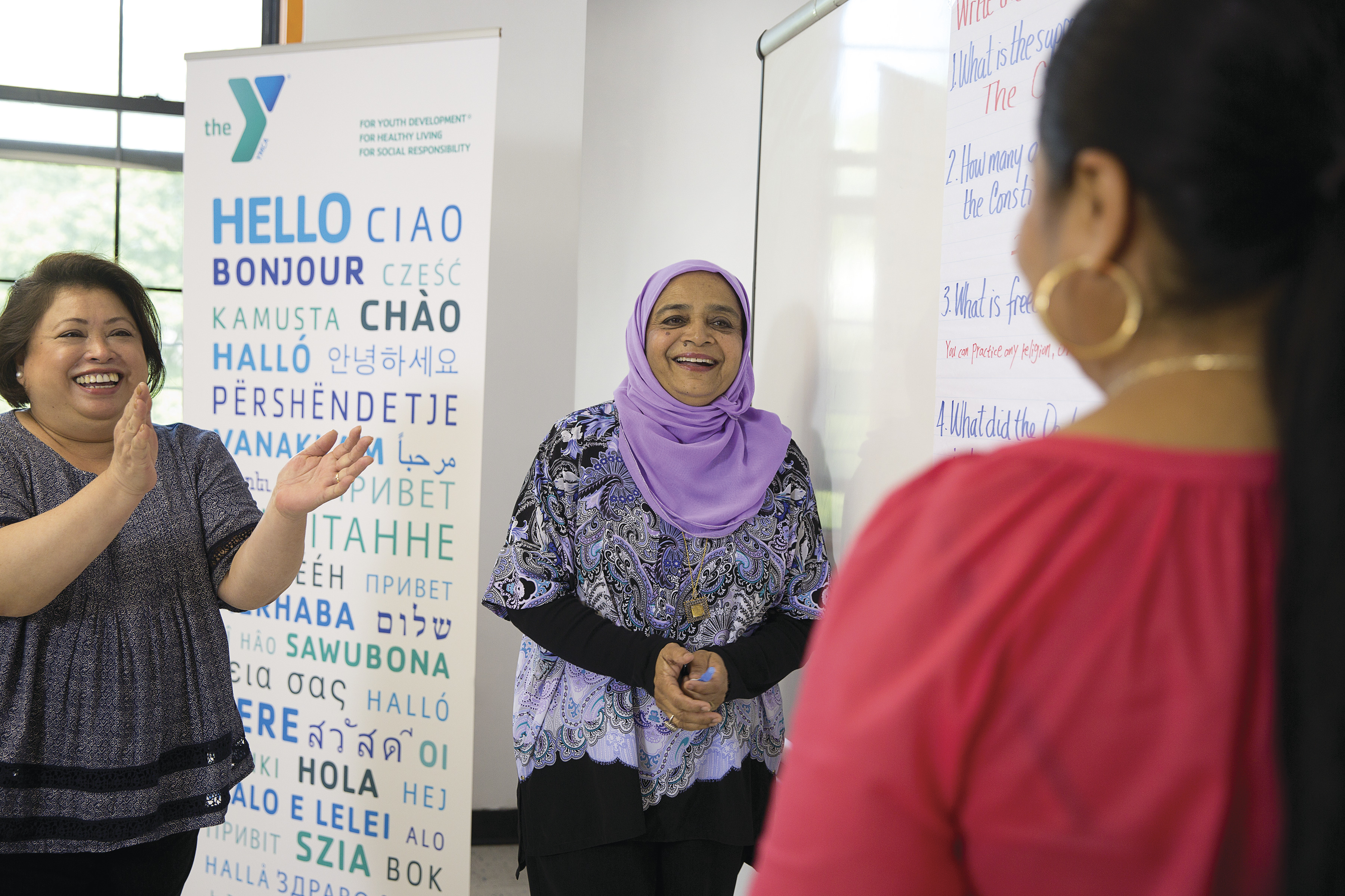 Women giving a standing ovation to a newcomer at the YMCA