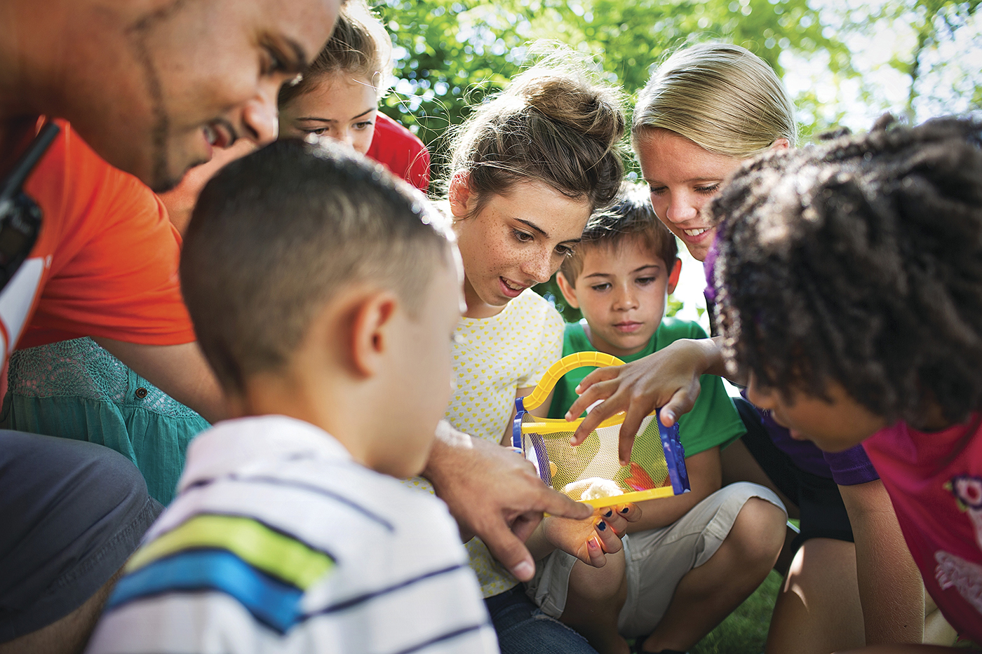 Children volunteering outside together