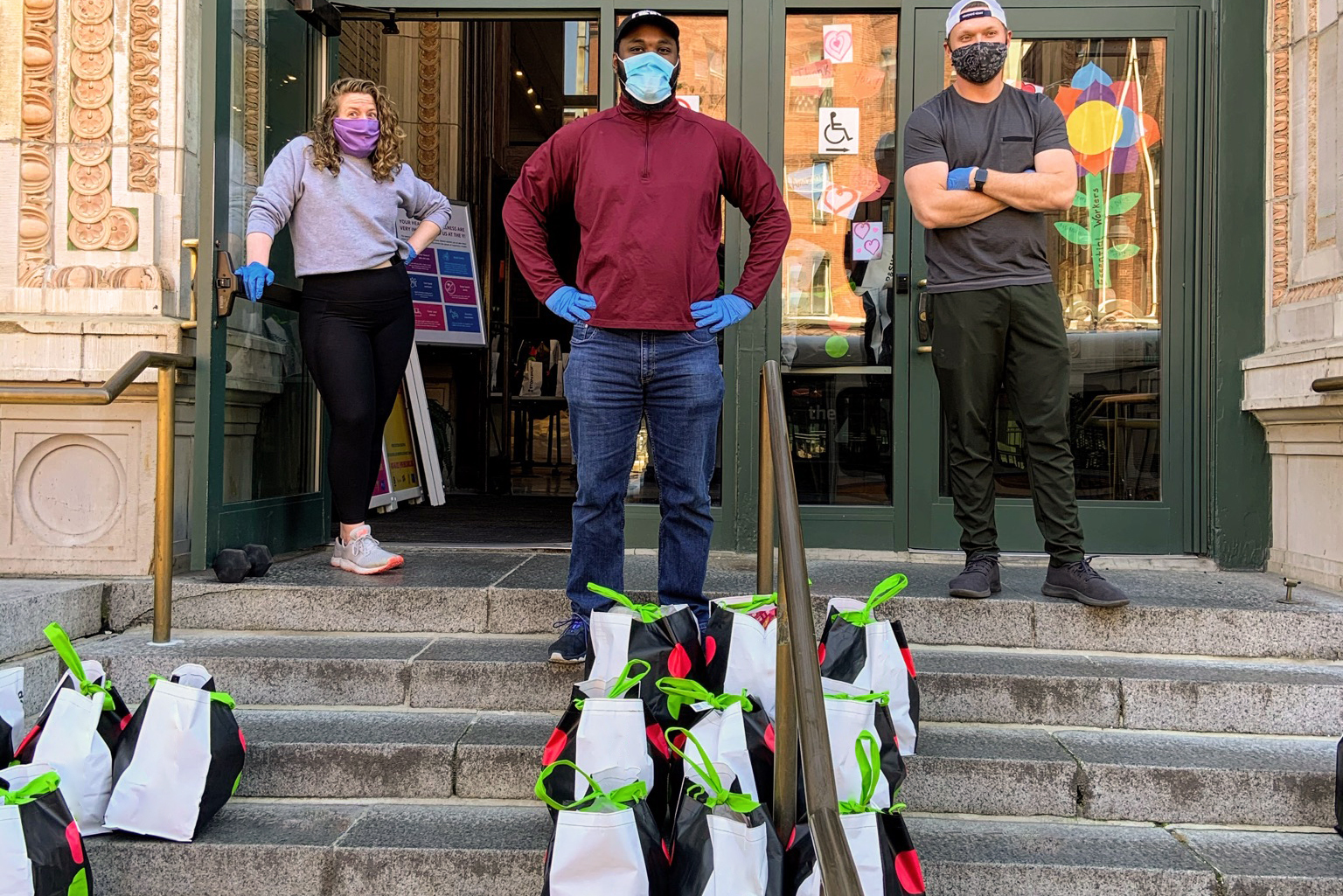 YMCA volunteers posing with bags