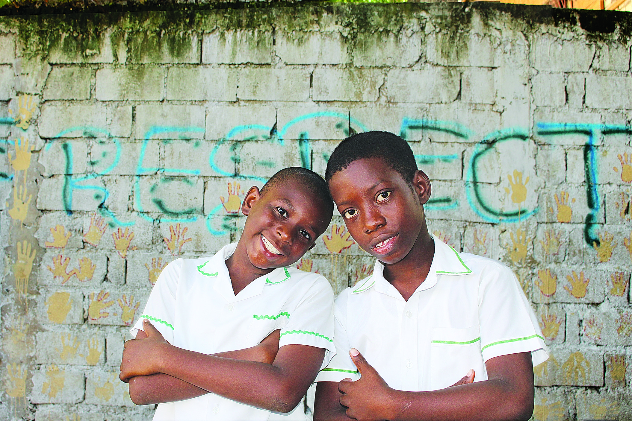 Two young kids pose together to represent global services