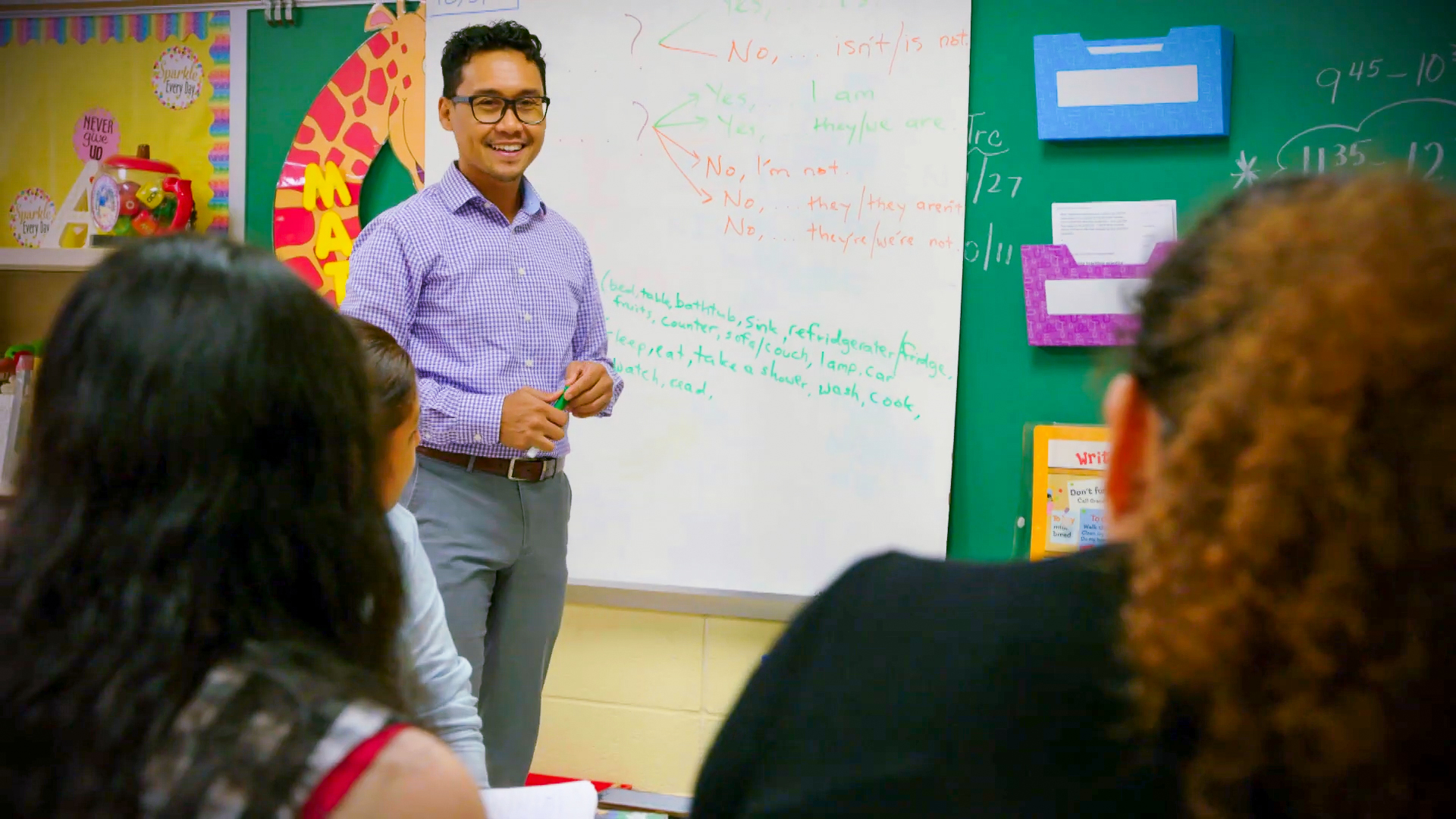 Man teaching english as a second language to students