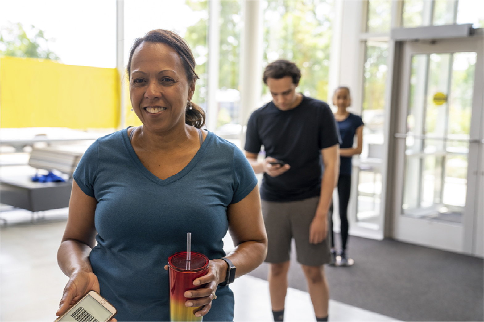 YMCA members walking through facilities to become a member