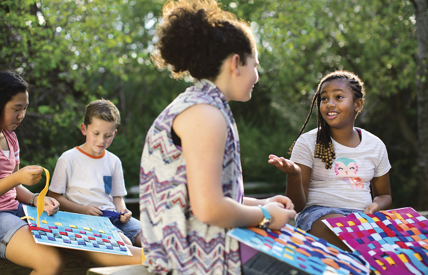 Children outside doing crafts - YMCA