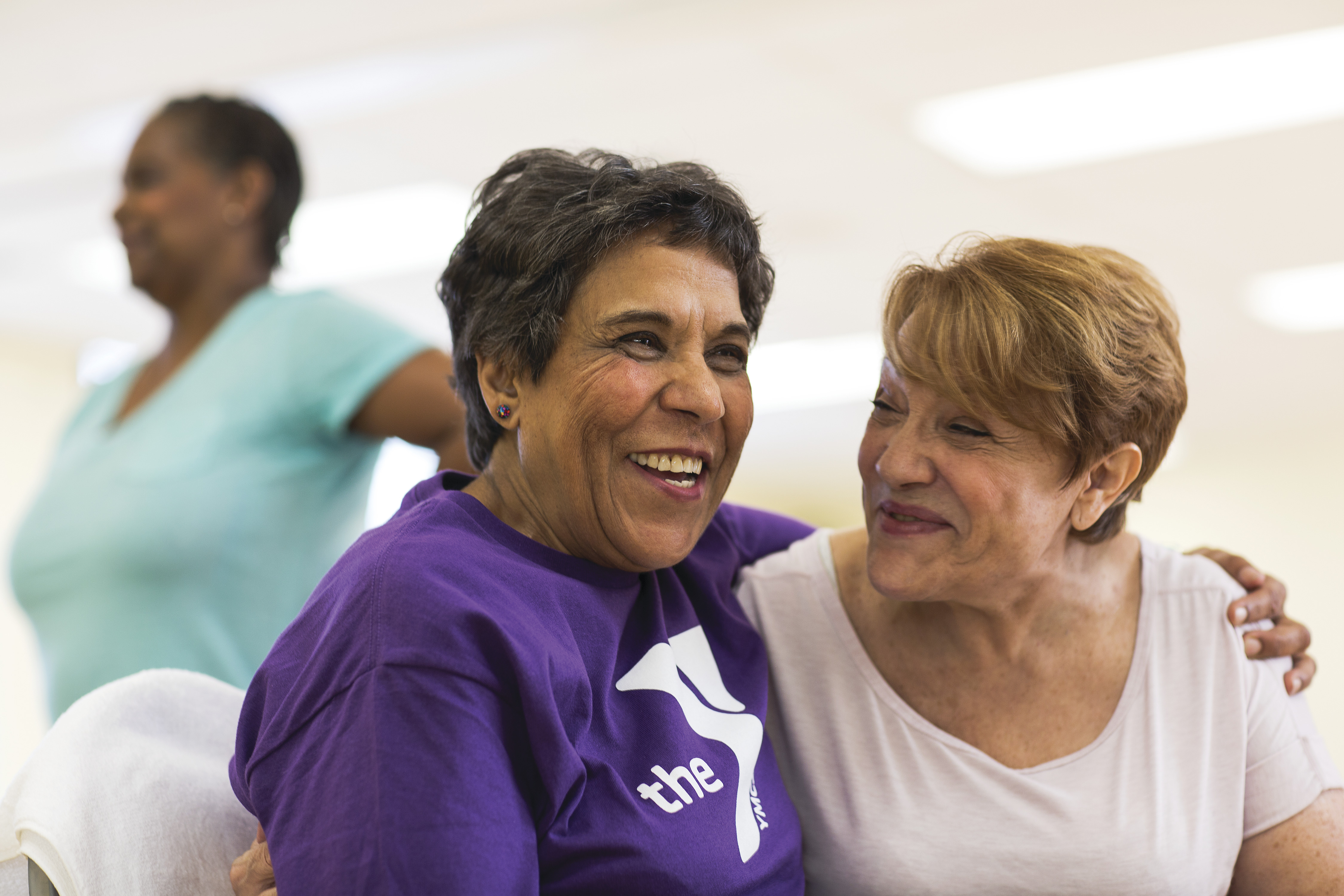 Two adults hugging at YMCA