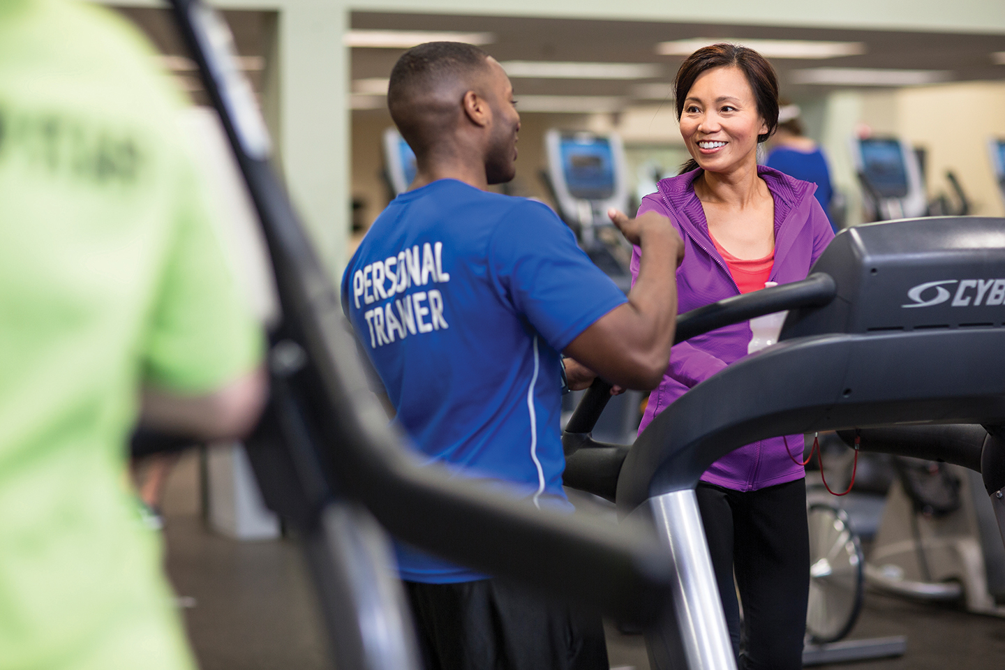 YMCA personal wellness instructor encouraging member