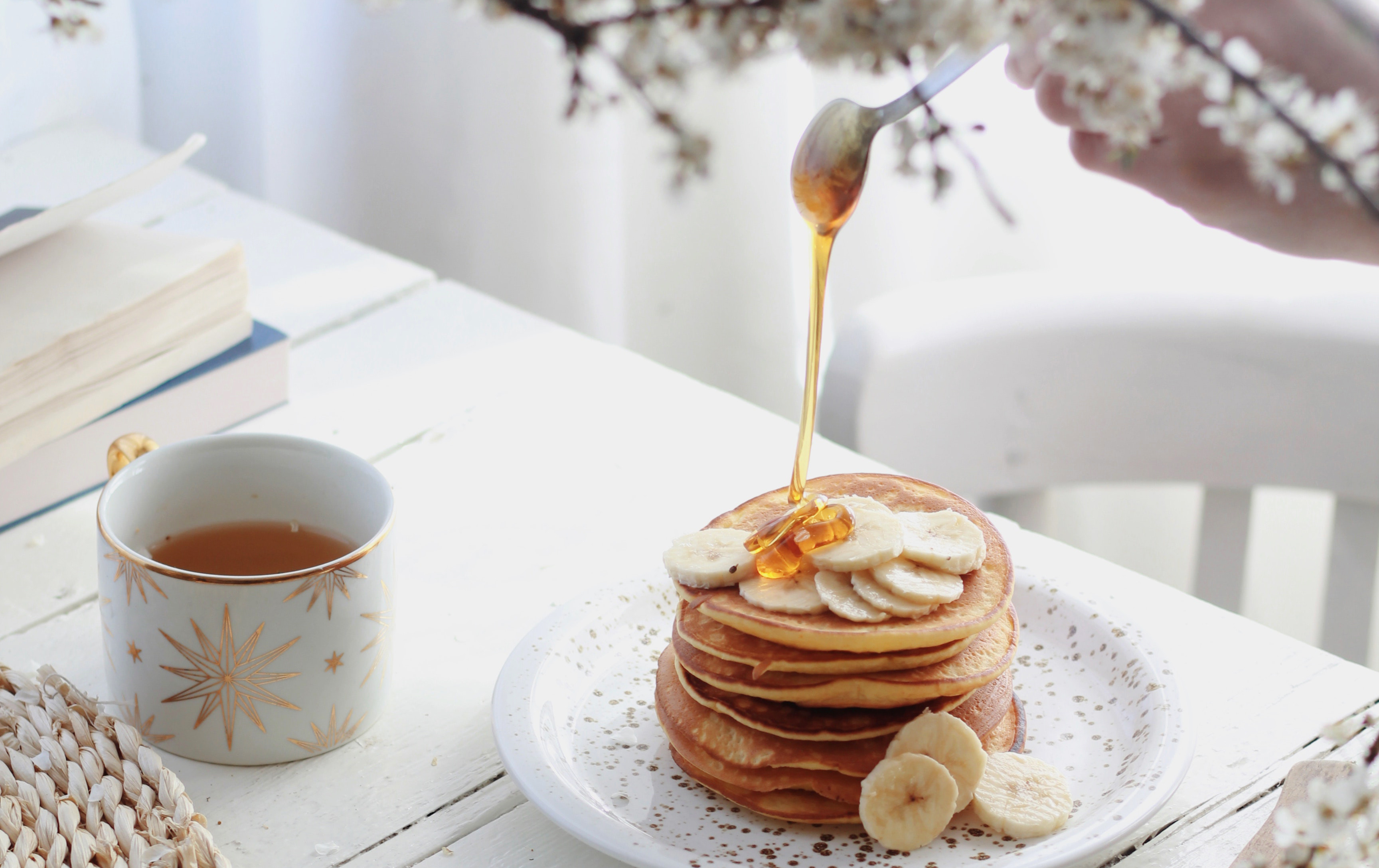 pancakes with banana slices and syrup