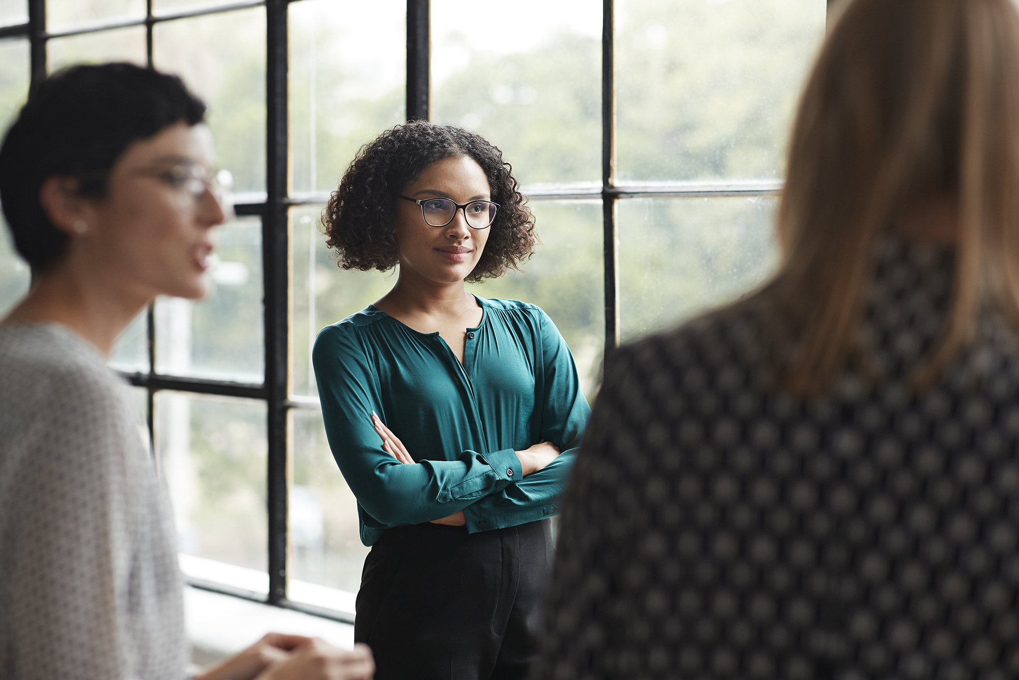 Women having discussion in front of window at YMCA