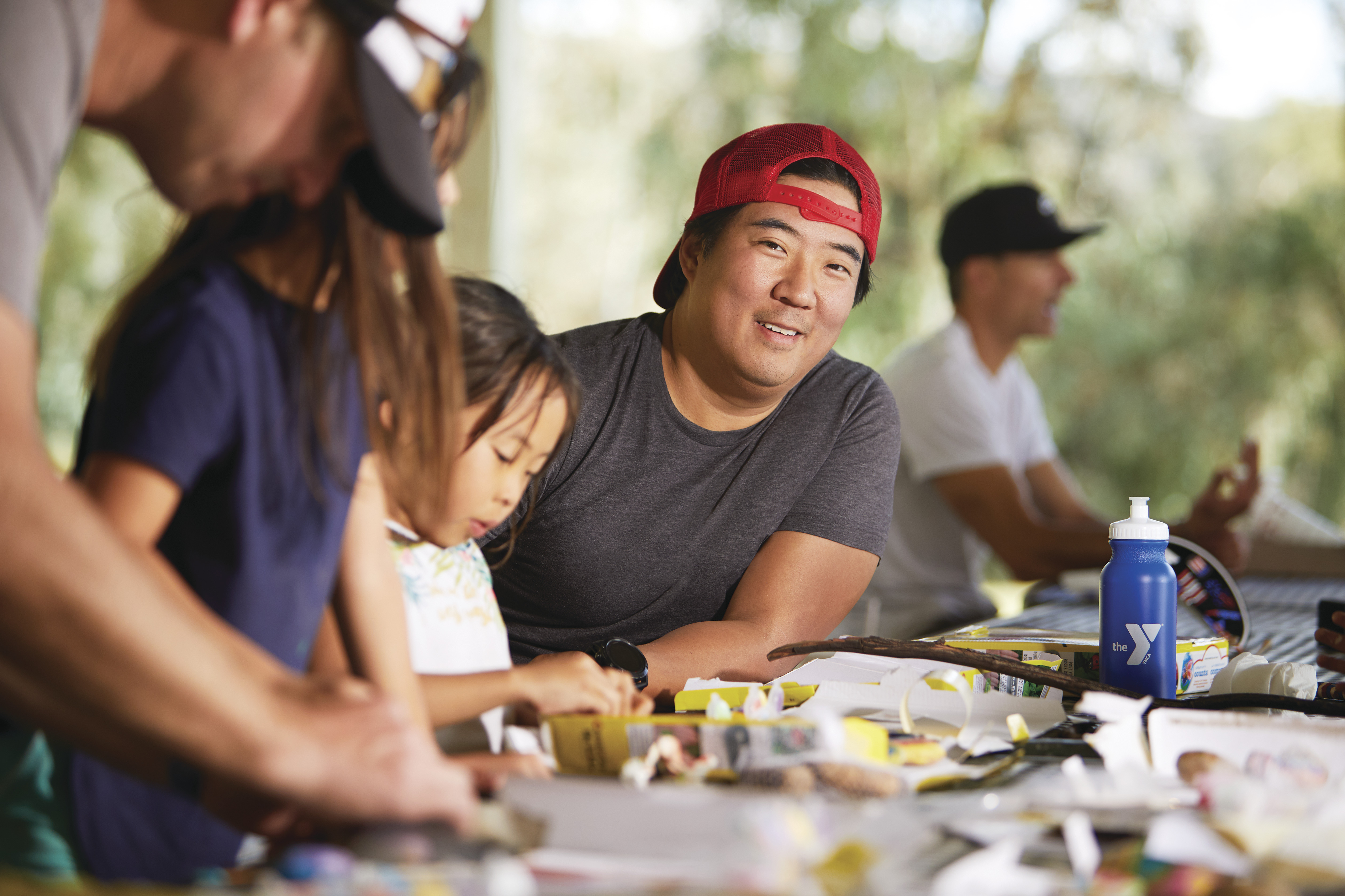 father and daughter doing crafts together at YMCA camp