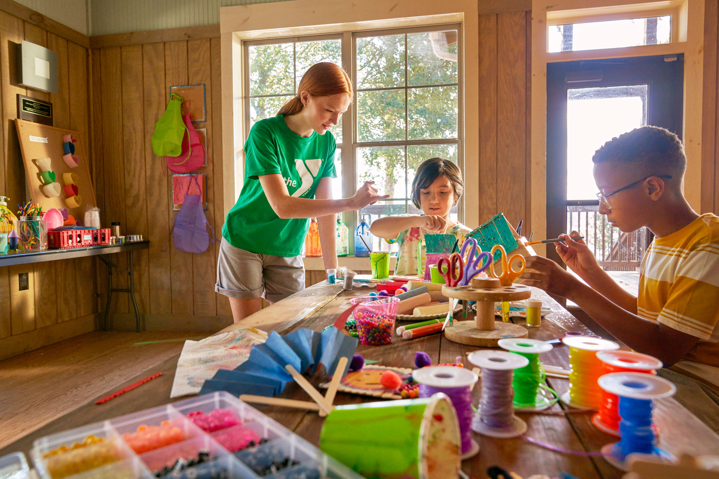 Boy and a girl doing arts and crafts at Day camp