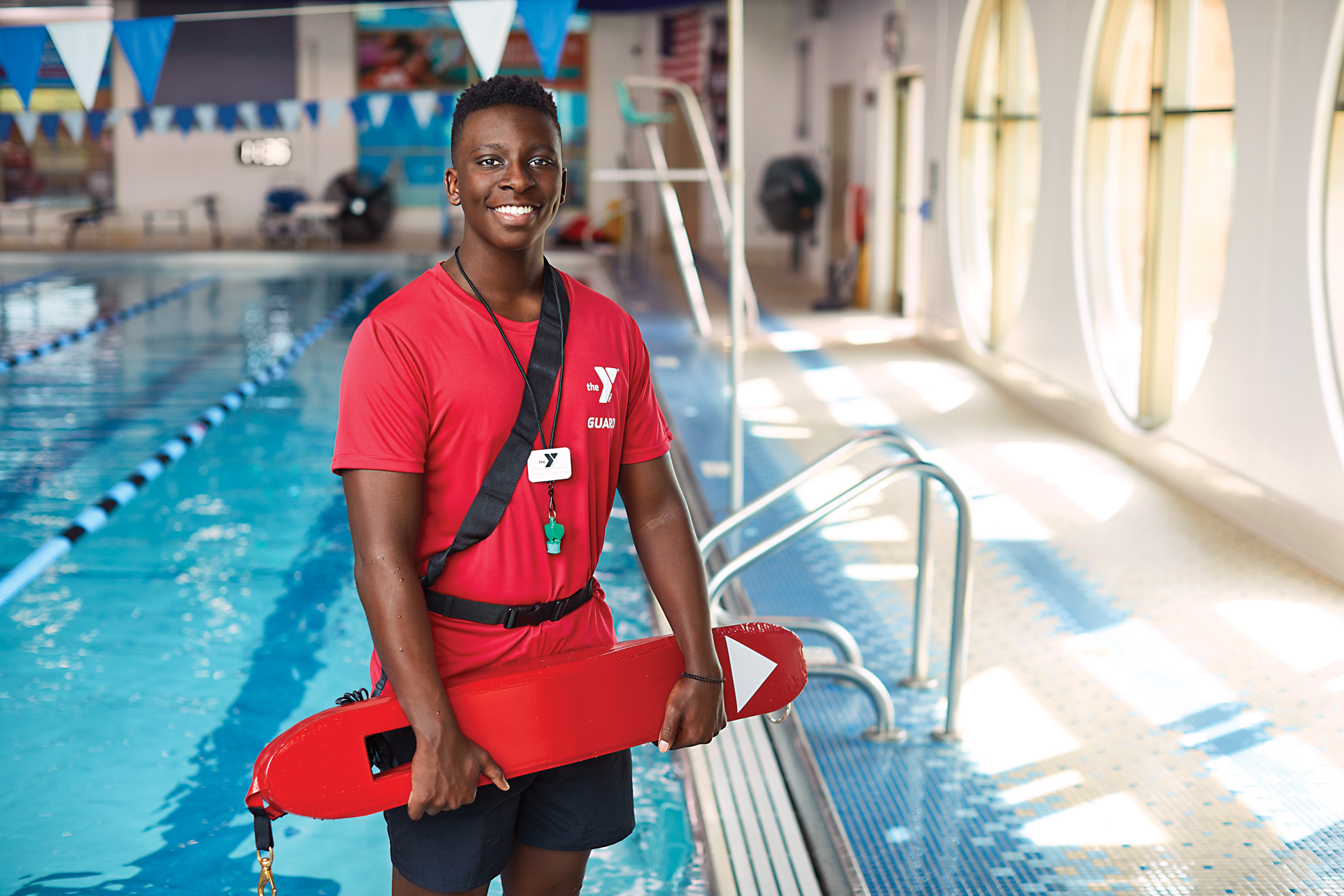 Smiling male lifeguard
