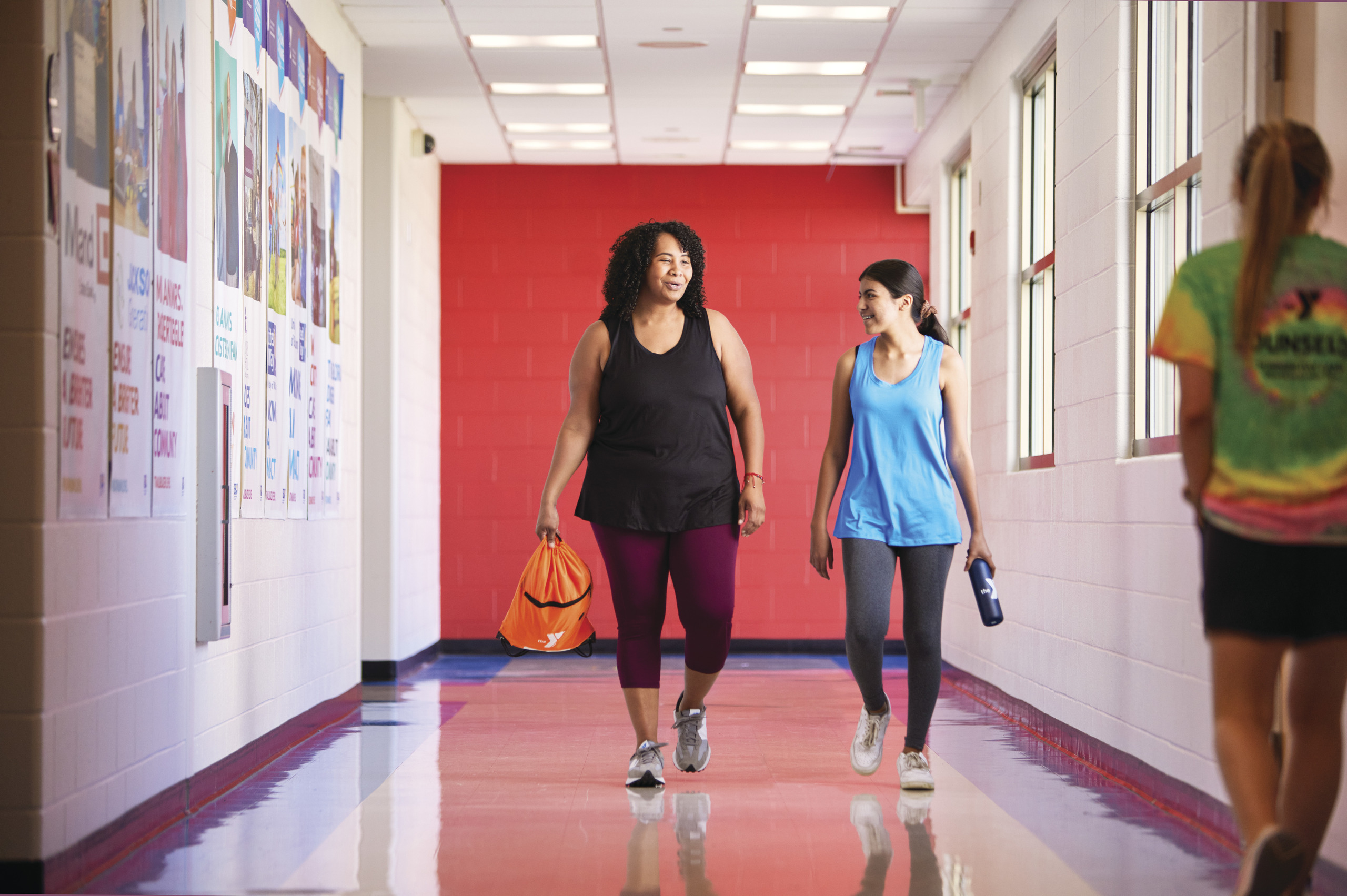 Mother and daughter entering a YMCA together