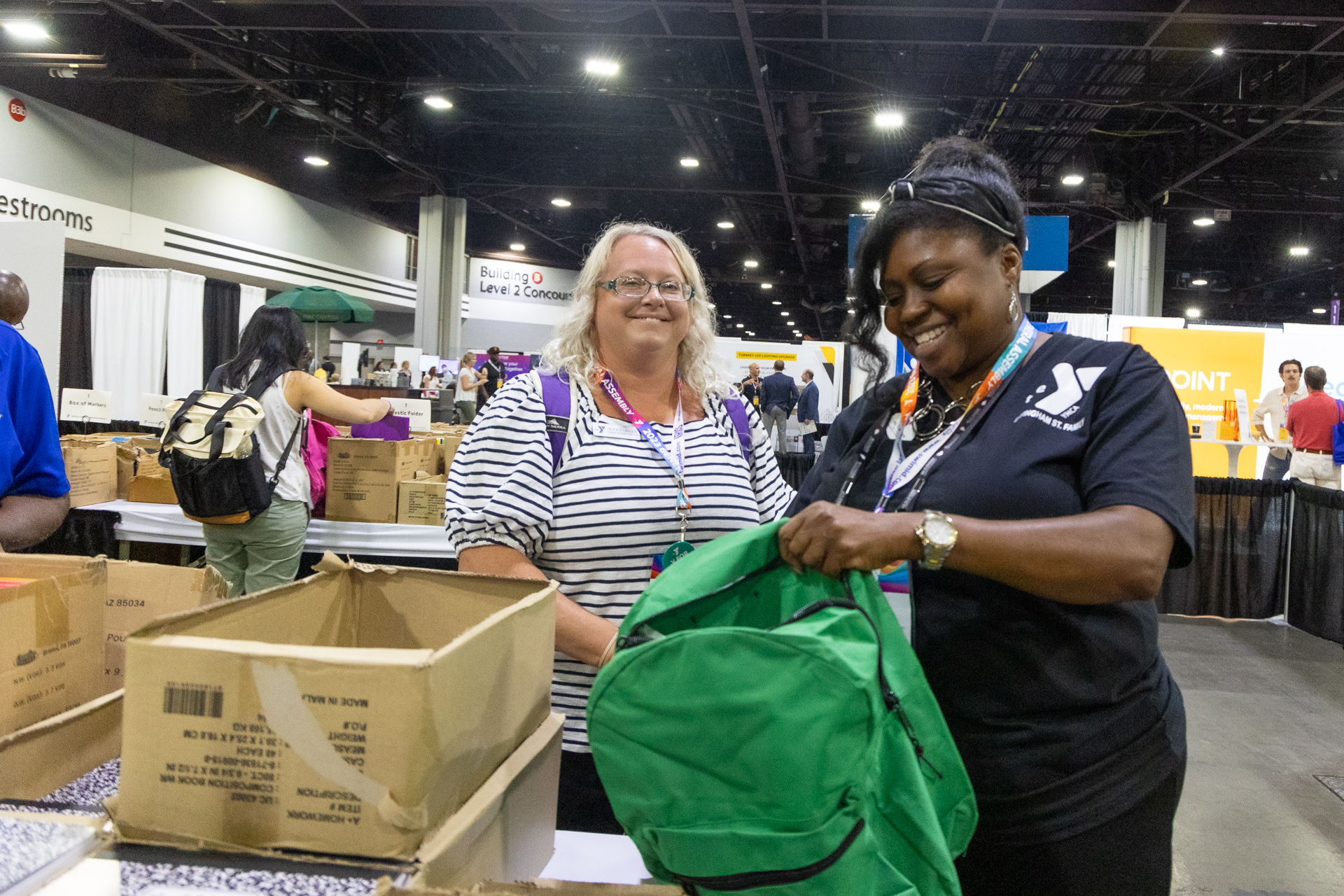 YMCA employees stuffing backpacks