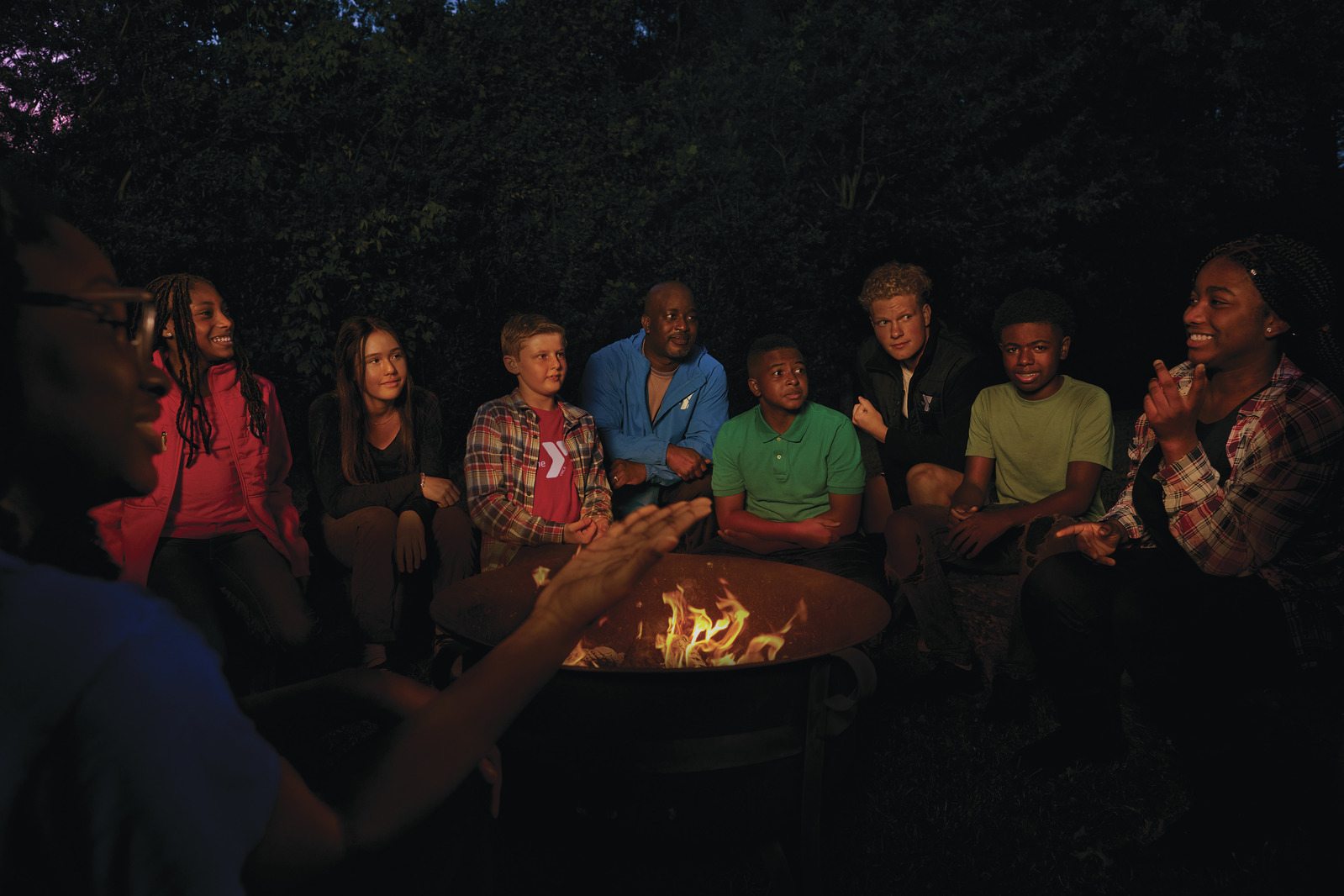 kids roasting marshmallows at a camp