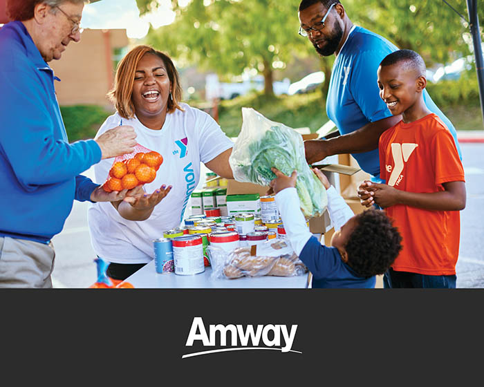 Volunteers distributing food with Out-of-School-Time program.