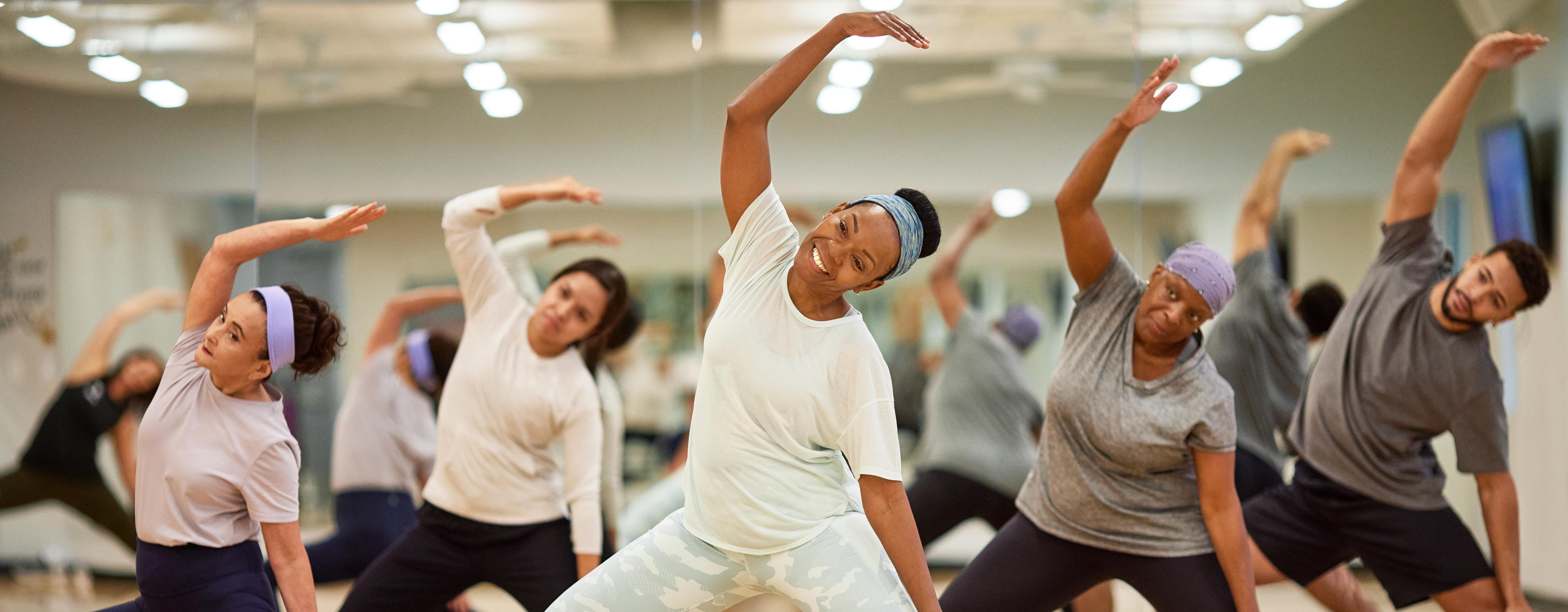 Group of women stretching in a fitness class