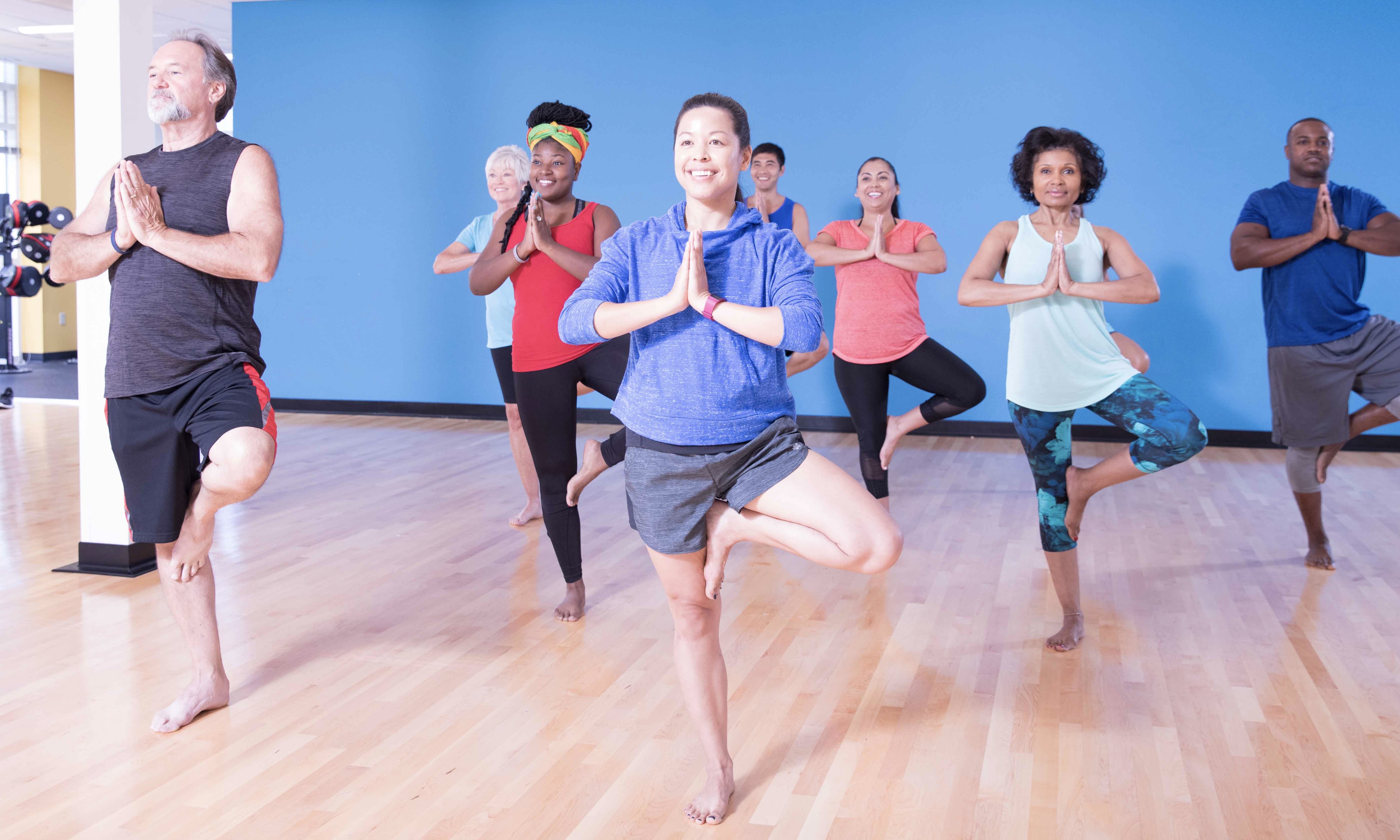 YMCA members balancing in class