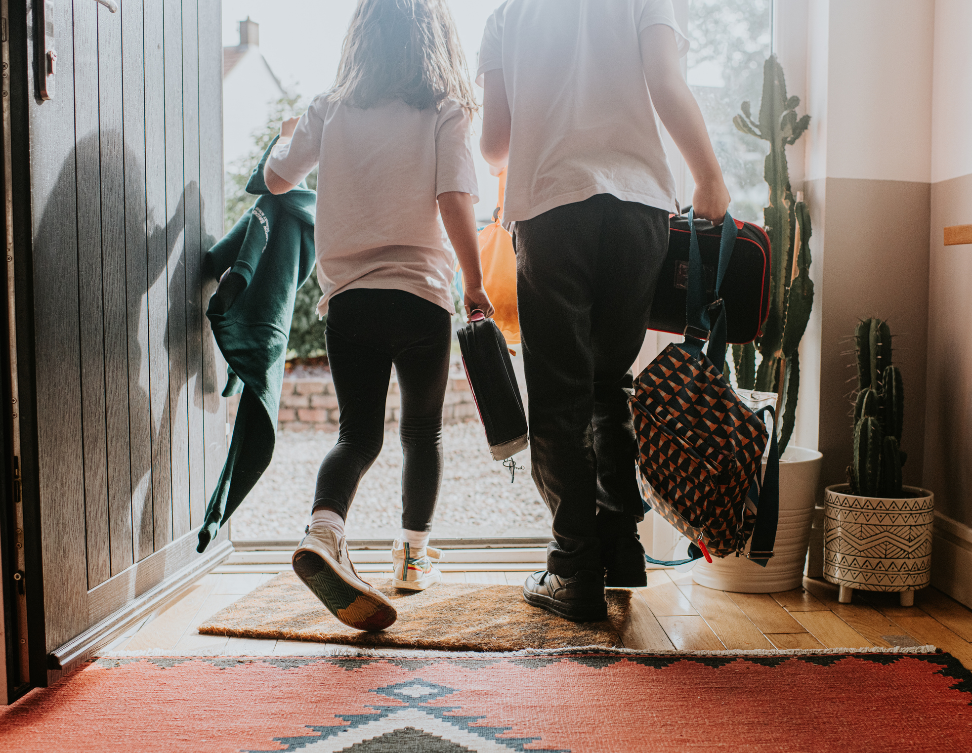Kids leaving the house to go to school