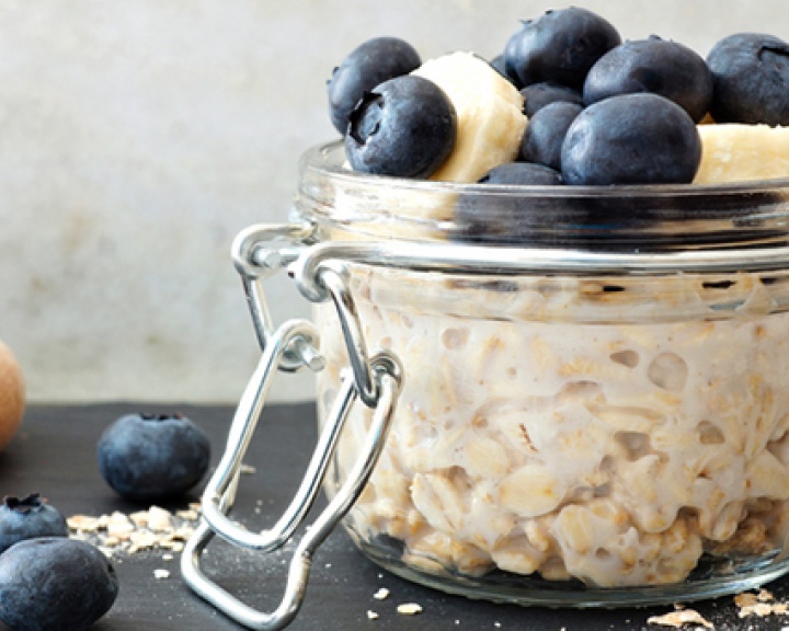 Overnight oats in a clamp lid jar topped with blueberries and banana slices