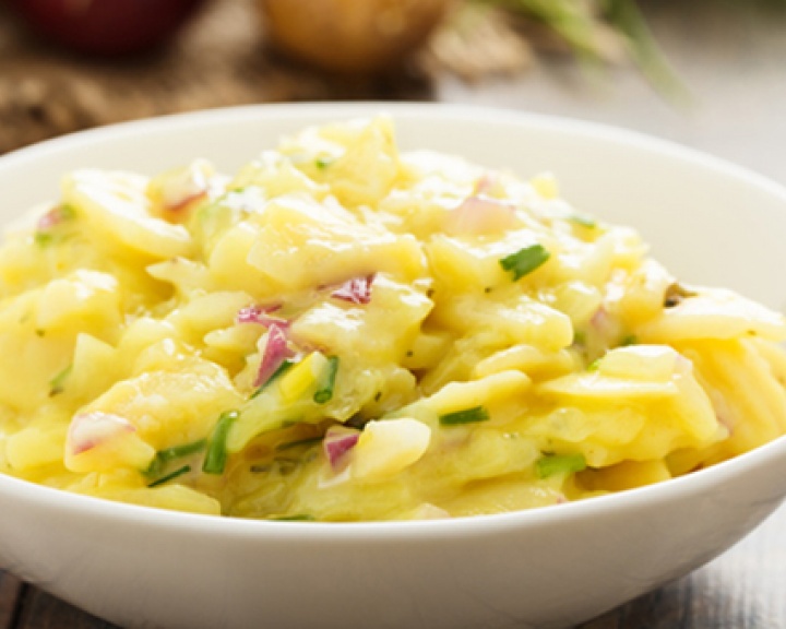 Potato salad in a white bowl