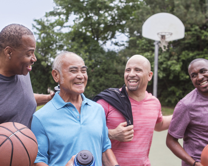 group of men playing basketball