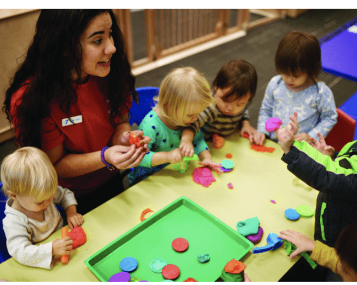 YMCA child care worker with kids