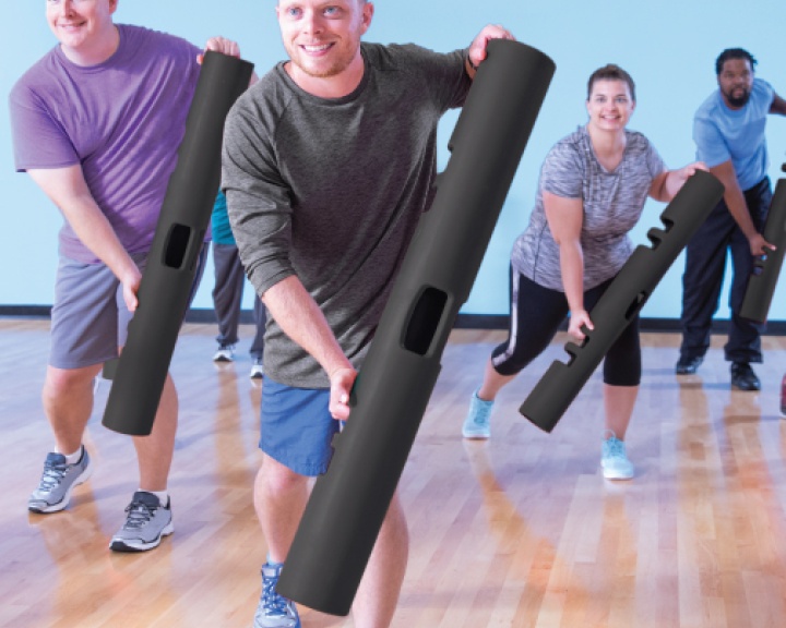 Man holding foam roller in firness class